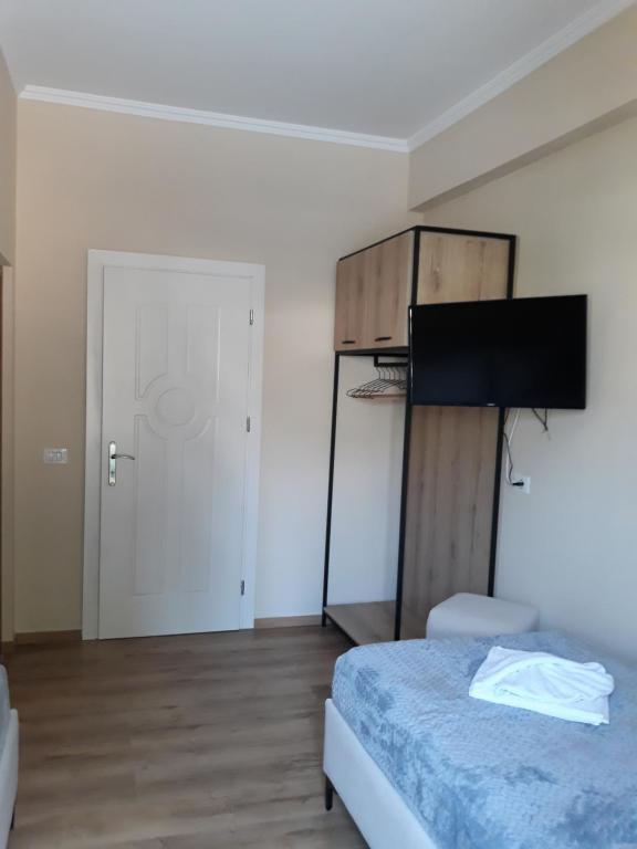 Postel nebo postele na pokoji v ubytování Qiqi Hotel