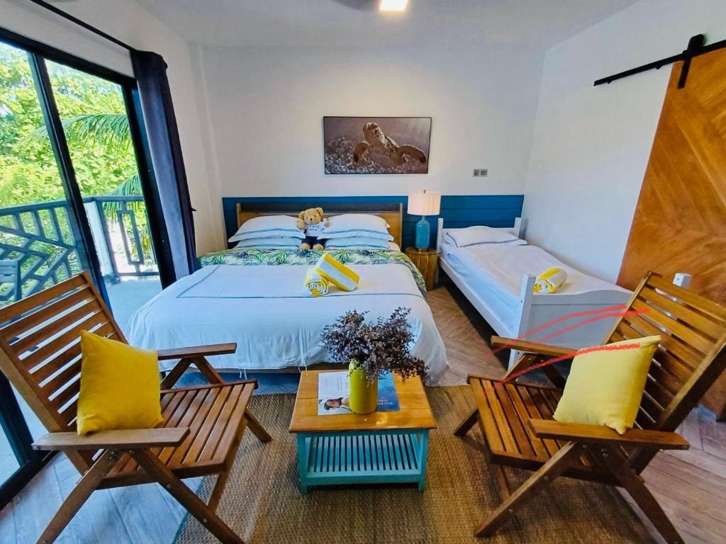 Postel nebo postele na pokoji v ubytování Palms Retreat