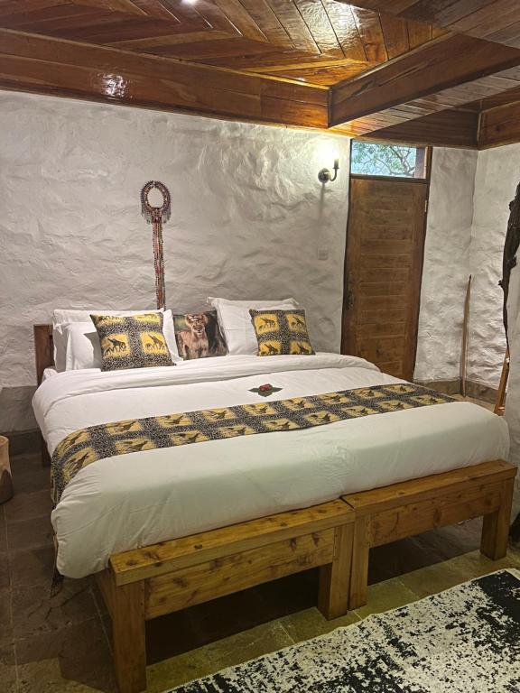 Postel nebo postele na pokoji v ubytování Olaloi Mara Camp