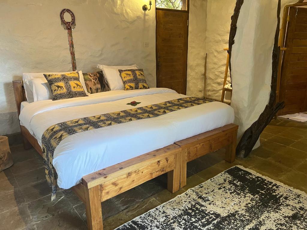 Postel nebo postele na pokoji v ubytování Olaloi Mara Camp