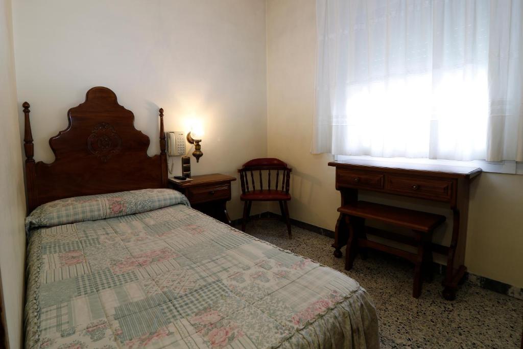 Postel nebo postele na pokoji v ubytování Hotel Delavall