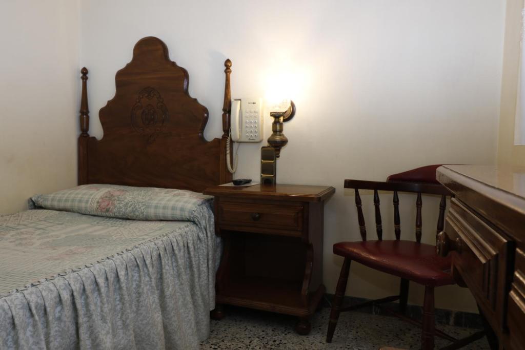 Postel nebo postele na pokoji v ubytování Hotel Delavall
