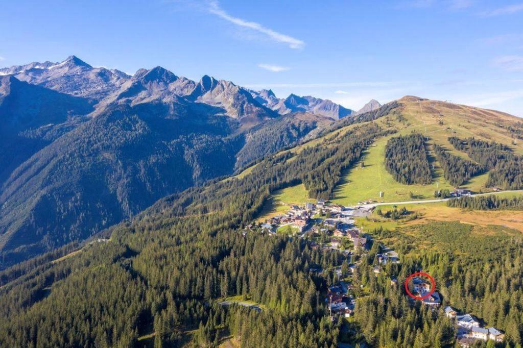 an aerial view of a mountain with houses and trees at Chalet Zillertal Arena 1 in Kirchdorf