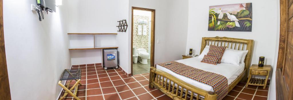 Postel nebo postele na pokoji v ubytování Hotel Brisas La Gaviota Mariquit-Tolima