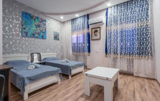Postel nebo postele na pokoji v ubytování Art-Gallery Avlabari