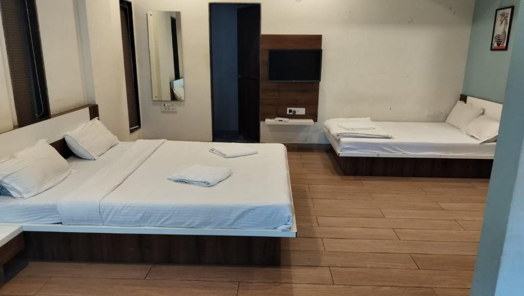 Postel nebo postele na pokoji v ubytování Fortune Resort