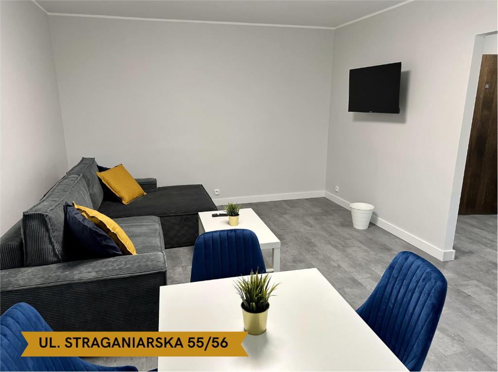 Televízia a/alebo spoločenská miestnosť v ubytovaní Lunette Apartments