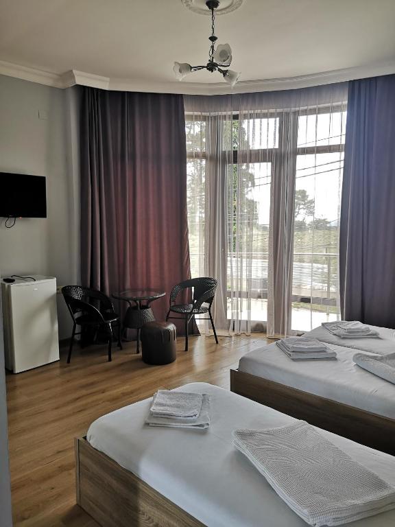 Postel nebo postele na pokoji v ubytování FRESH Hotel Kobuleti