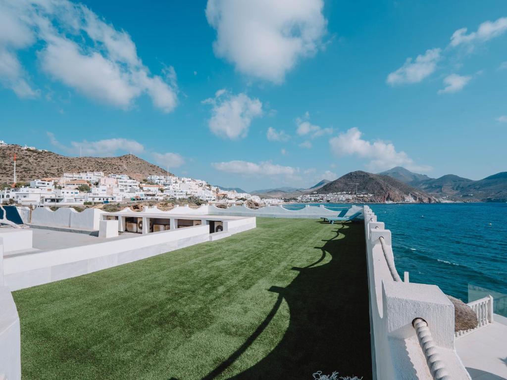 a view of the ocean from the balcony of a villa at Villa Singular in San José