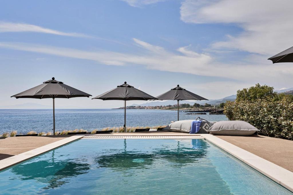 The swimming pool at or close to Beachfront Alassa Villas with Private Pools