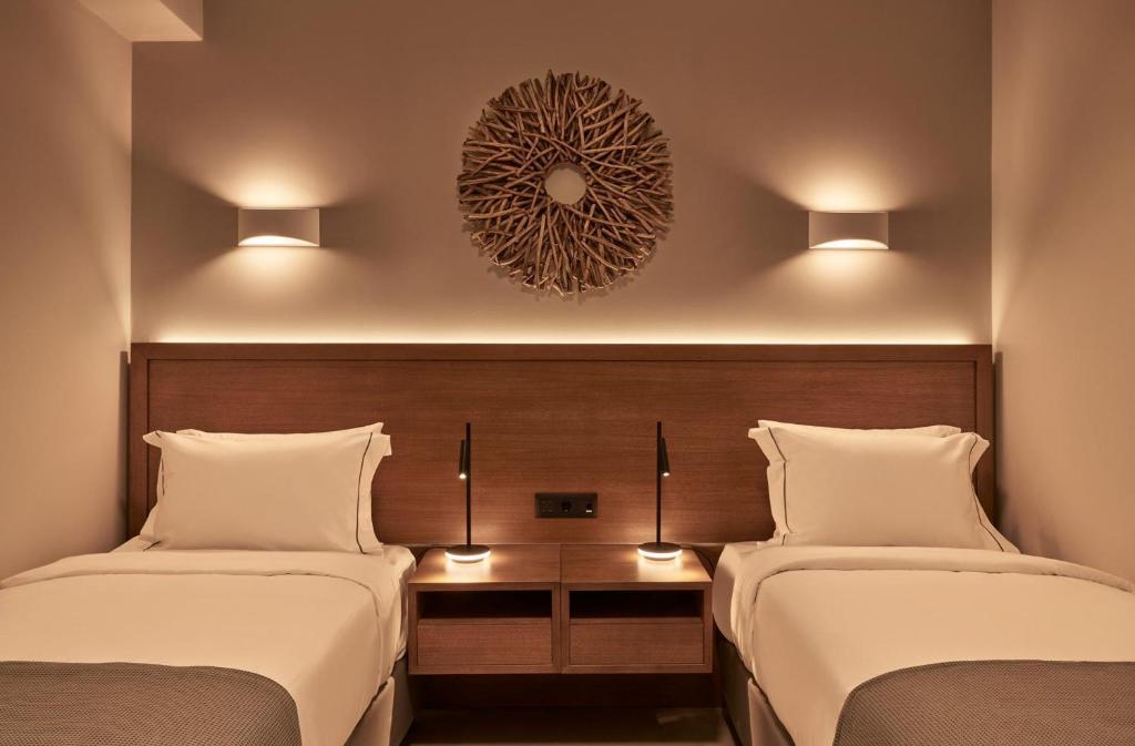 A bed or beds in a room at Beachfront Alassa Villas w Private Pools Complex