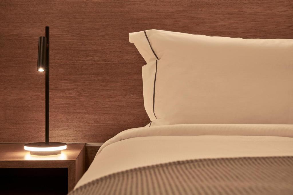 A bed or beds in a room at Beachfront Alassa Villas w Private Pools Complex