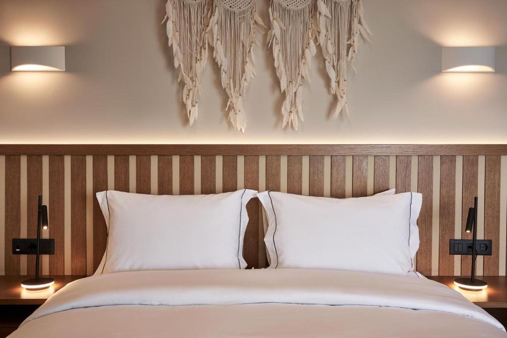 A bed or beds in a room at Beachfront Alassa Villas w Private Pools Complex