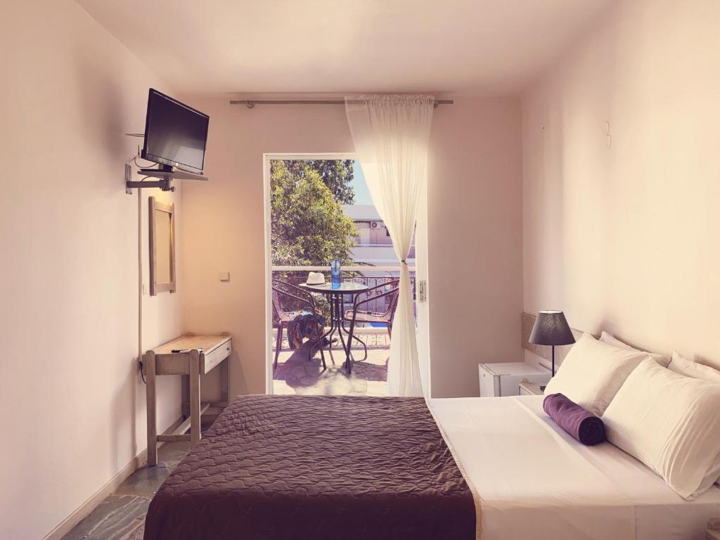 Postel nebo postele na pokoji v ubytování Ermis Hotels & Resorts
