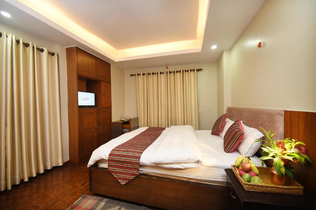 Postel nebo postele na pokoji v ubytování Mums Homestay & Studio Apartments