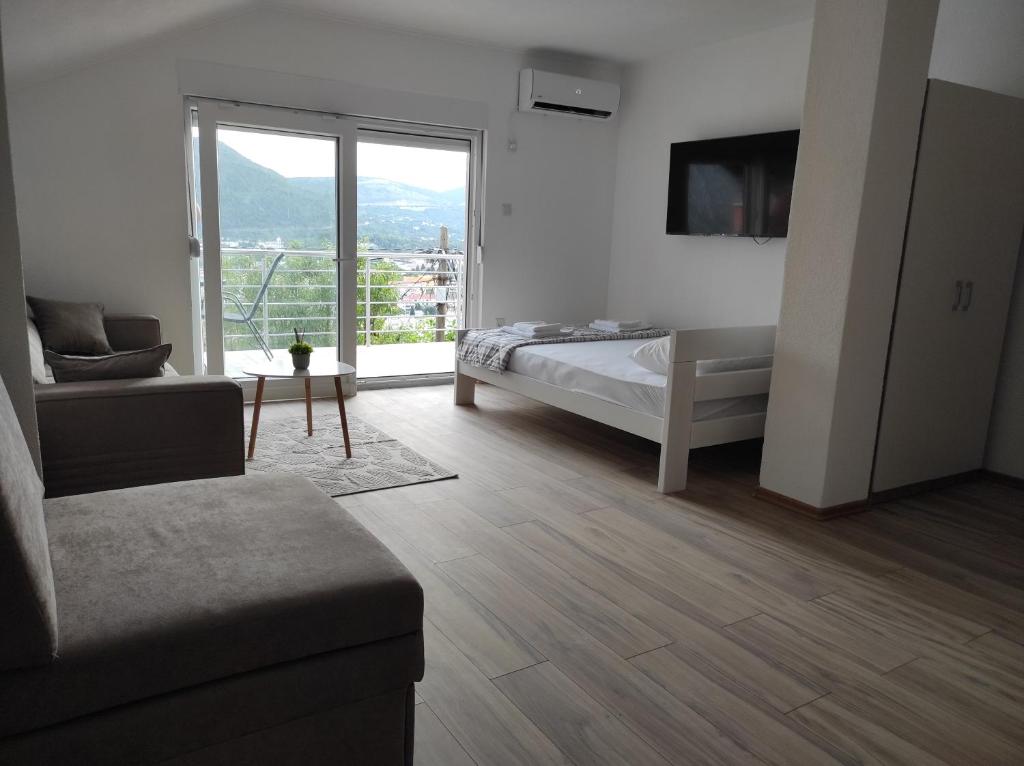 Ένα ή περισσότερα κρεβάτια σε δωμάτιο στο View of the city - Studio Apartment