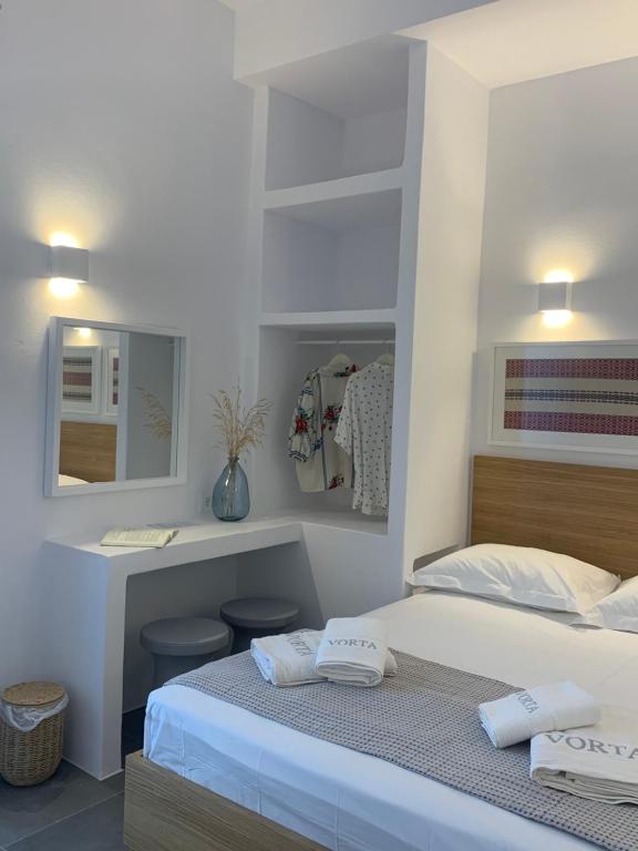 Postel nebo postele na pokoji v ubytování Vorta Naxos