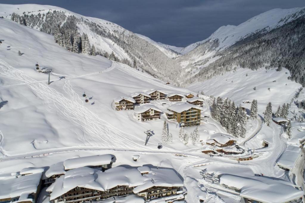 a snow covered mountain with a ski lodge at Edelweisshaus Top 2 in Königsleiten