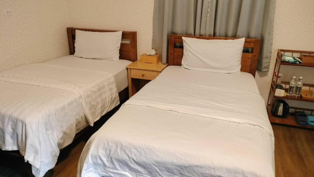 Postel nebo postele na pokoji v ubytování 水源棧
