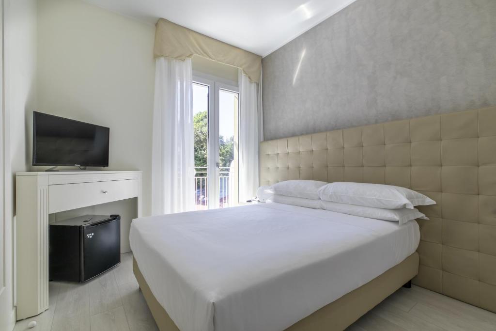 Postel nebo postele na pokoji v ubytování Hotel Gallia & Resort