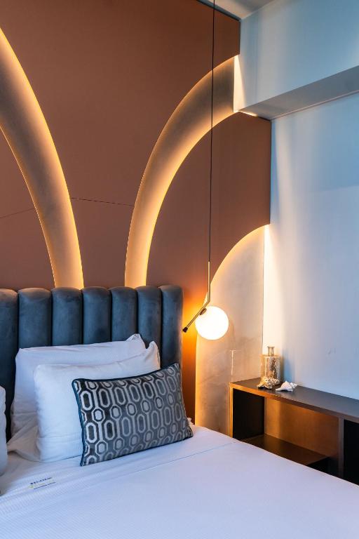 Postel nebo postele na pokoji v ubytování Relais sul Mare Boutique Hotel