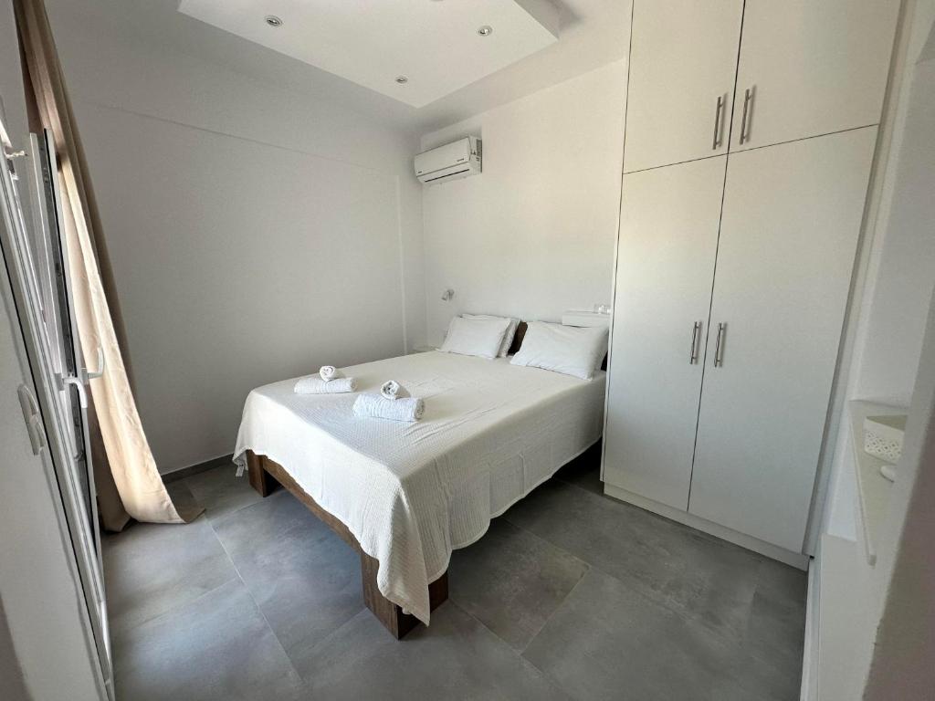 Postel nebo postele na pokoji v ubytování Pandora Studios Skiathos