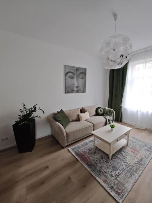 a living room with a couch and a coffee table at Pfalz Oase in Landau in der Pfalz