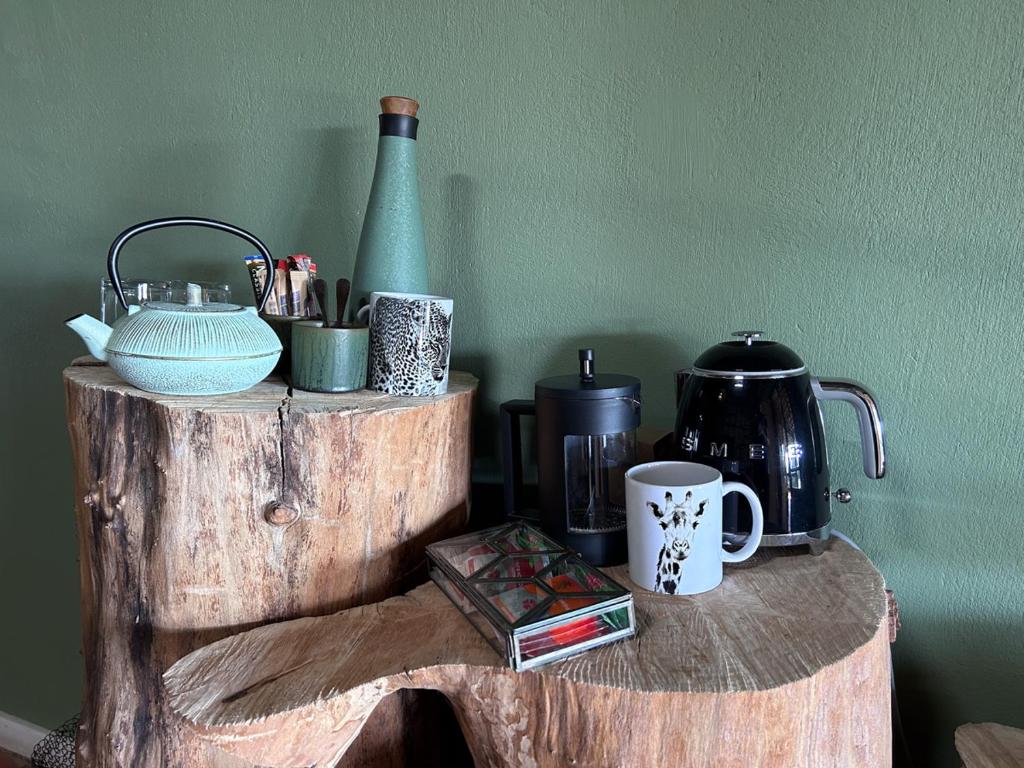 a wooden shelf with various items on top of it at Tzamenkomst River Lodge in Colesberg