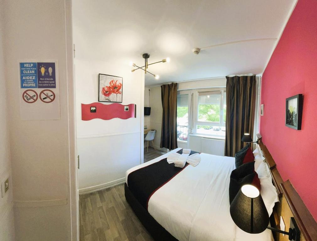 Postel nebo postele na pokoji v ubytování Hôtel OpalOriental
