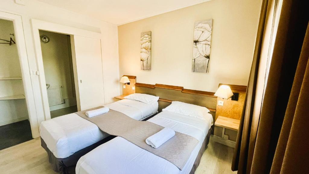 Postel nebo postele na pokoji v ubytování Hôtel OpalOriental