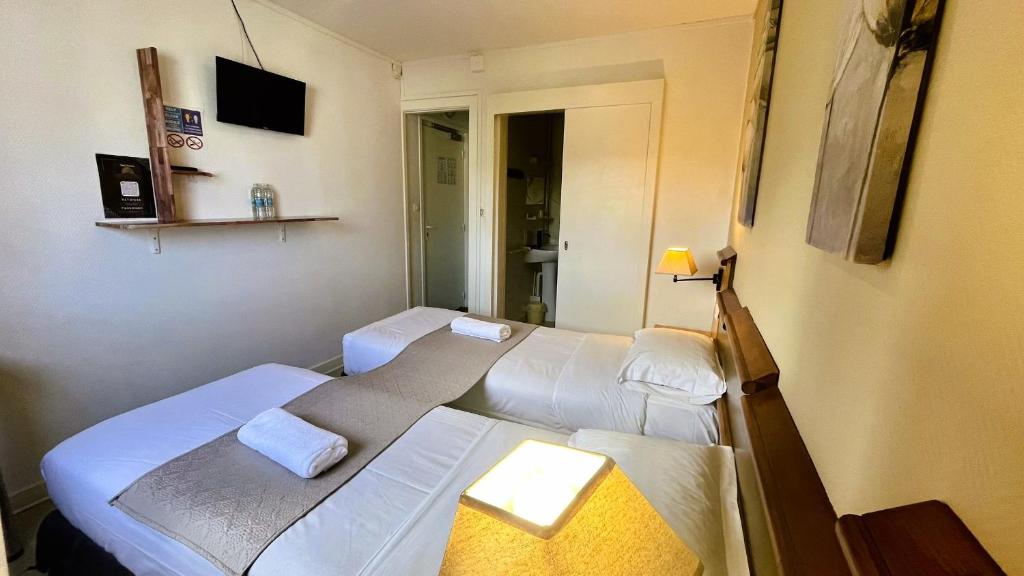 Postel nebo postele na pokoji v ubytování Hôtel OpalOriental