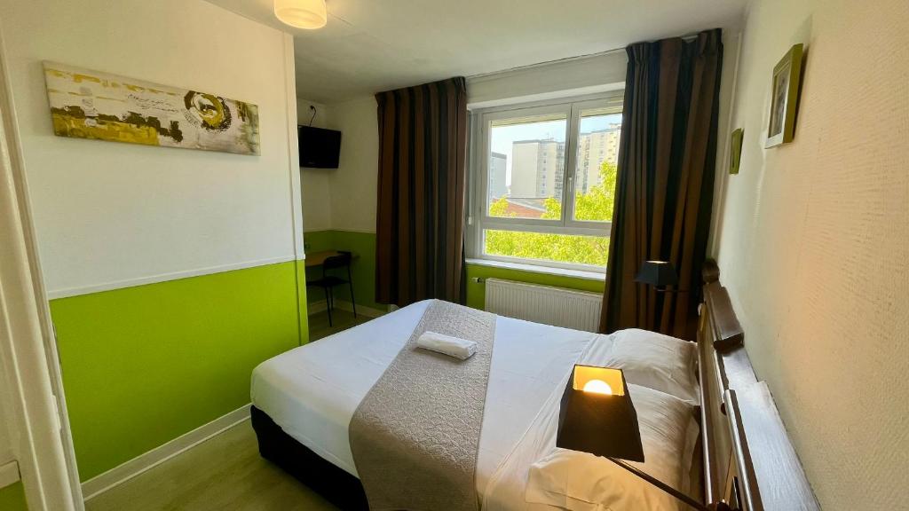 Postel nebo postele na pokoji v ubytování Hôtel OpalOriental