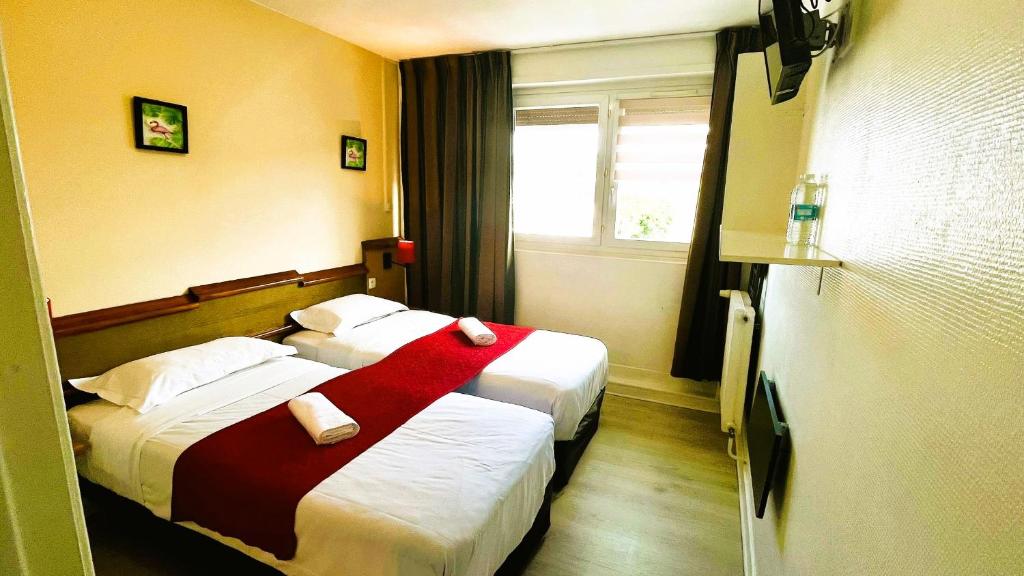 Postel nebo postele na pokoji v ubytování Hôtel OpalOriental