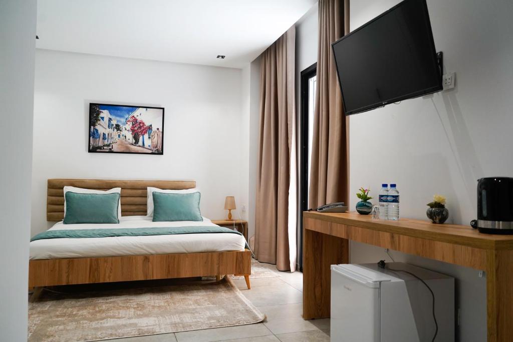 TV o dispositivi per l'intrattenimento presso Hôtel Suisse Tunis