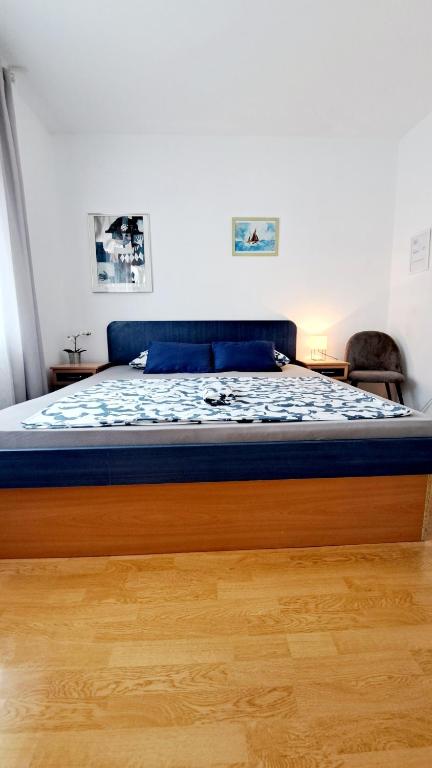 Posteľ alebo postele v izbe v ubytovaní Apartmani E&G