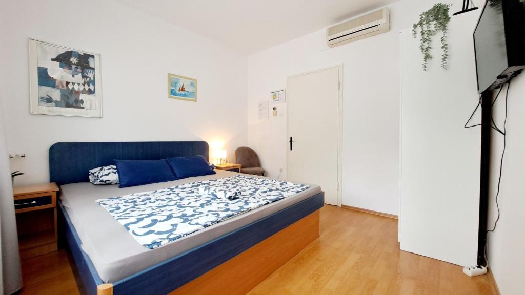 Posteľ alebo postele v izbe v ubytovaní Apartmani E&G