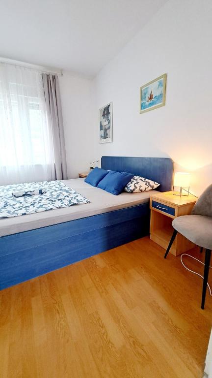Posteľ alebo postele v izbe v ubytovaní Apartmani E&G
