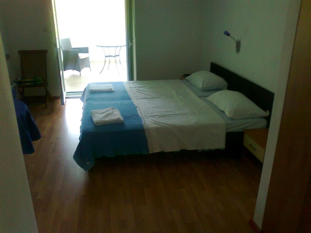 Postel nebo postele na pokoji v ubytování Apartments Silvana