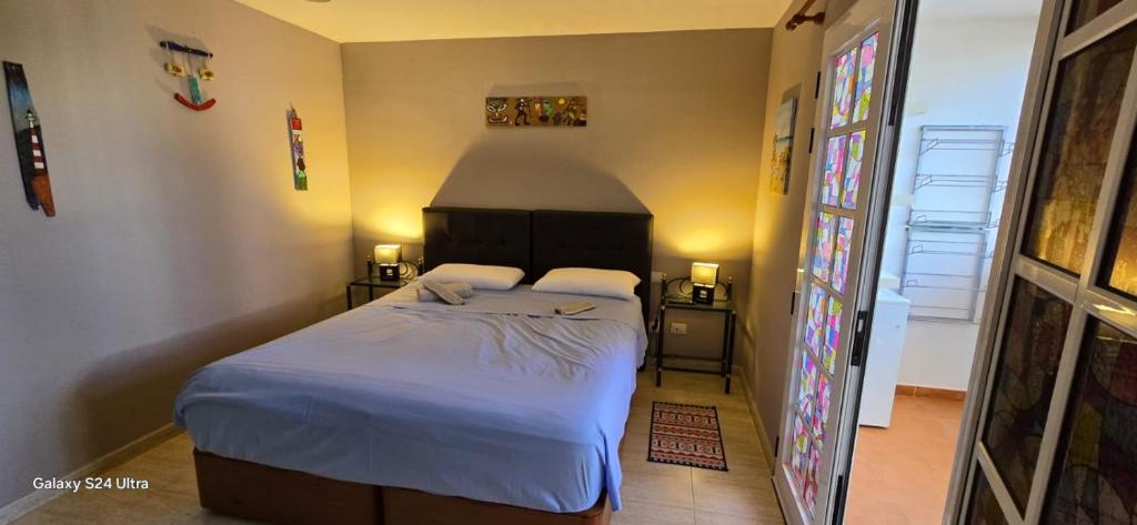 Postel nebo postele na pokoji v ubytování Beach House Lanzarote