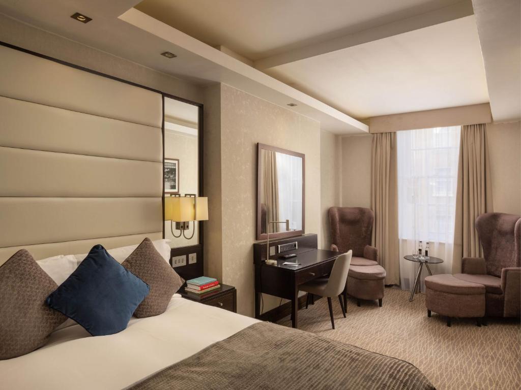 a hotel room with a bed and a desk at Montcalm Brewery, London City in London
