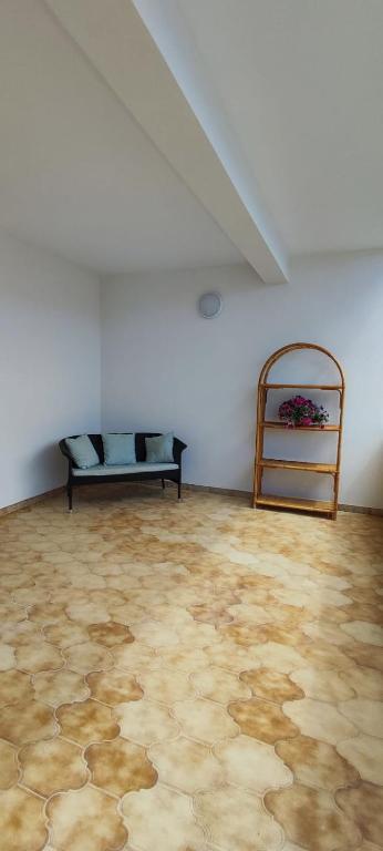 a room with a couch in the corner of a room at Pumo Rosso in Porto Cesareo