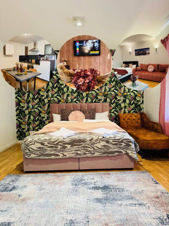 a bedroom with a bed and a tv on a wall at Naturparadies vor den Toren Hamburgs in Halstenbek