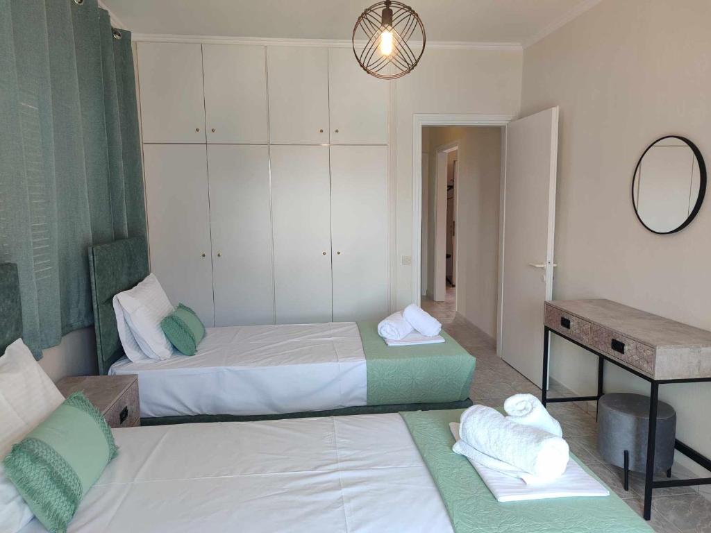 Postel nebo postele na pokoji v ubytování Elite Suites