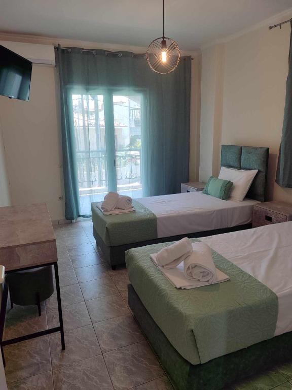 Postel nebo postele na pokoji v ubytování Elite Suites