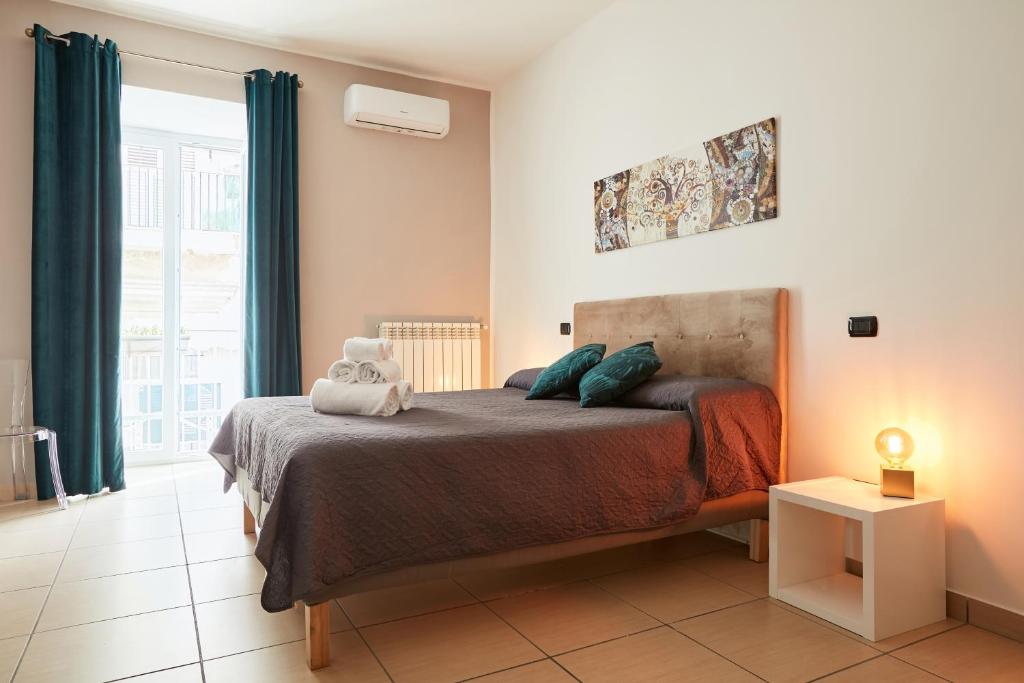 Letto o letti in una camera di Vicky's Luxury Guesthouse by NapoliApartments