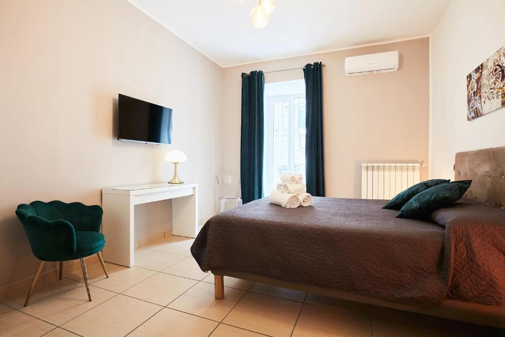 TV o dispositivi per l'intrattenimento presso Vicky's Luxury Guesthouse by NapoliApartments