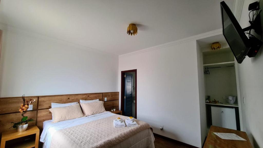 Postel nebo postele na pokoji v ubytování Biz & Biu Pousada Lavras Novas