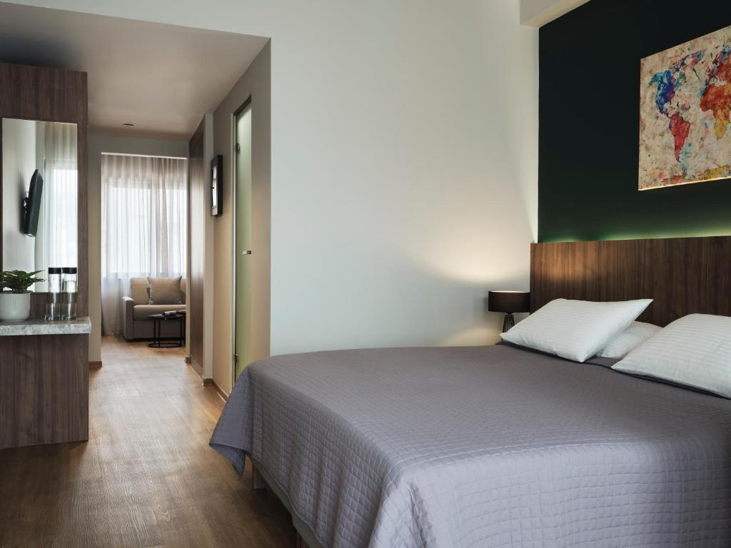 Postel nebo postele na pokoji v ubytování Candia Hotel