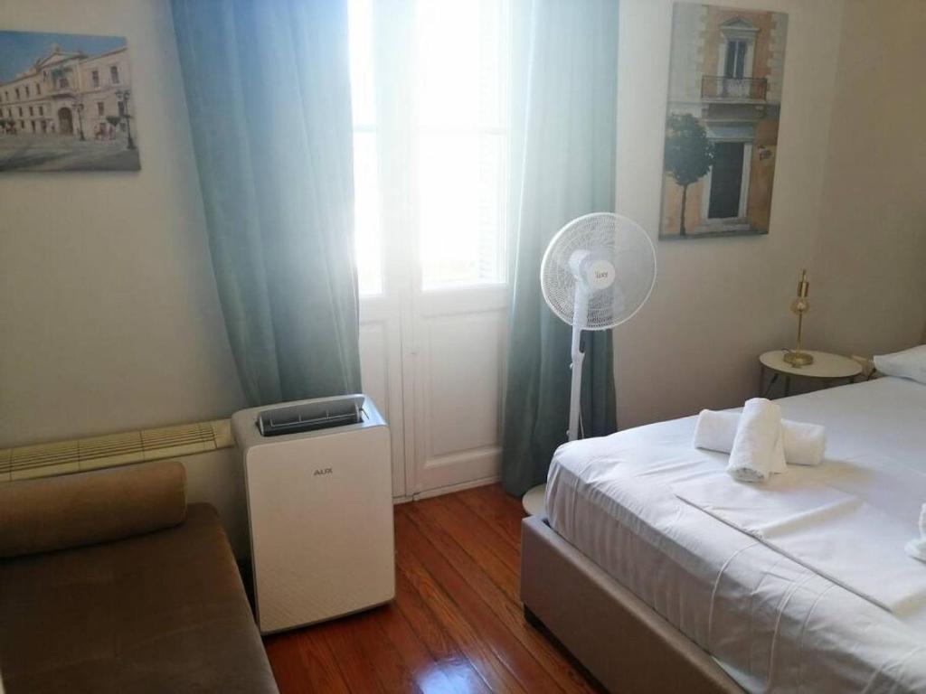 Posteľ alebo postele v izbe v ubytovaní Elegant apartment under the Acropolis