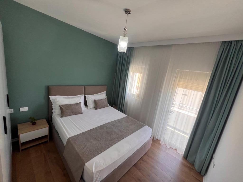Postel nebo postele na pokoji v ubytování Wave Beachfront Apartments